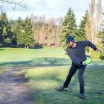 Jamison Orr of Port Townsend tees off on the first hole during a demonstration round of disc golf at the Port Townsend Golf Park on Monday during an open house marking the change in management by the nonprofit Friends of the Port Townsend Golf Park. The disc course measures about 6,800 feet in length and is played over part of the same layout as the golf course. (Steve Mullensky/for Peninsula Daily News)