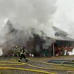 Both Clallam County fire districts 2 and 3 sent firefighters to a barn fire on Blue Mountain Road on Monday afternoon. (Matthew Nash/Olympic Peninsula News Group)