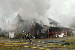 Both Clallam County fire districts 2 and 3 sent firefighters to a barn fire on Blue Mountain Road on Monday afternoon. (Matthew Nash/Olympic Peninsula News Group)