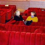 Katherine Baril, center, and other patrons arrived early for a screening of the movie Ferrari in the newly made-over Rosebud cinema, part of the Rose Theatre in Port Townsend. (Diane Urbani de la Paz/for Peninsula Daily News)
