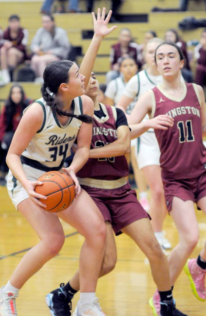 KEITH THORPE/PENINSULA DAILY NEWS 
Port Angeles' Lexie Smith, left, looks for the net defended by Kingston's Taizah Franklin, center, and Tavyn Belgarde, left, on Tuesday at Port Angeles High School.