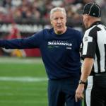 Seattle Seahawks head coach Pete Carroll argues a call with side judge Jim Quirk (5) in the first half of an NFL football game against the Arizona Cardinals on Sunday in Glendale, Ariz. (Rick Scuteri/The Associated Press)