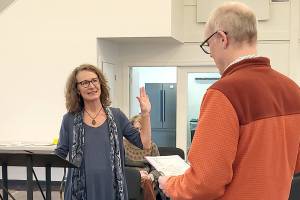 Pam Petranek, left, is sworn in for her second term as a Port of Port Townsend commissioner on Jan. 10 by Executive Director Eron Berg. (Photo courtesy Port of Port Townsend)