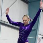 Susannah Sharp of Sequim, competing for the joint Port Angeles/Sequim gymnastics team, preforms on the balance beam Monday at a meet in Port Angeles against Bainbridge. Bainbridge edged Port Angeles/Sequim 164-139. (Dave Logan/for Peninsula Daily News)