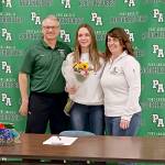 Natalie Robinson, center, celebrates signing to play softball at Columbia Basin College with her former high school coach Randy Steinman, left, and her current coach Morgan Worthington. (Pierre LaBossiere/Peninsula Daily News)
