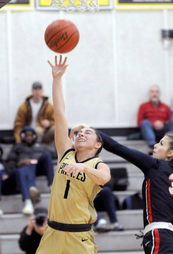 Peninsulas Talia Marini aims for the rim as Bellevues Marishka Boris defends on Wednesday at Peninsula College. (Keith Thorpe/Peninsula Daily News)