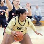 Peninsulas Jelissa Julmist, front, looks to swing around the defense of Bellevues Kristina Blauman on Wednesday in Port Angeles. (Keith Thorpe/Peninsula Daily News)