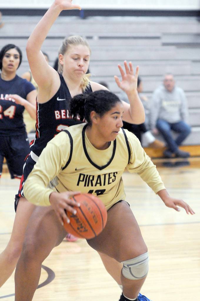 Peninsulas Jelissa Julmist, front, looks to swing around the defense of Bellevues Kristina Blauman on Wednesday in Port Angeles. (Keith Thorpe/Peninsula Daily News)