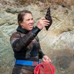 Annie Raymond, Jamestown SKlallam Tribe shellfish biologist, peers at a kelp sample, looking for spores. (Tiffany Royal/Northwest Indian Fisheries Commission)