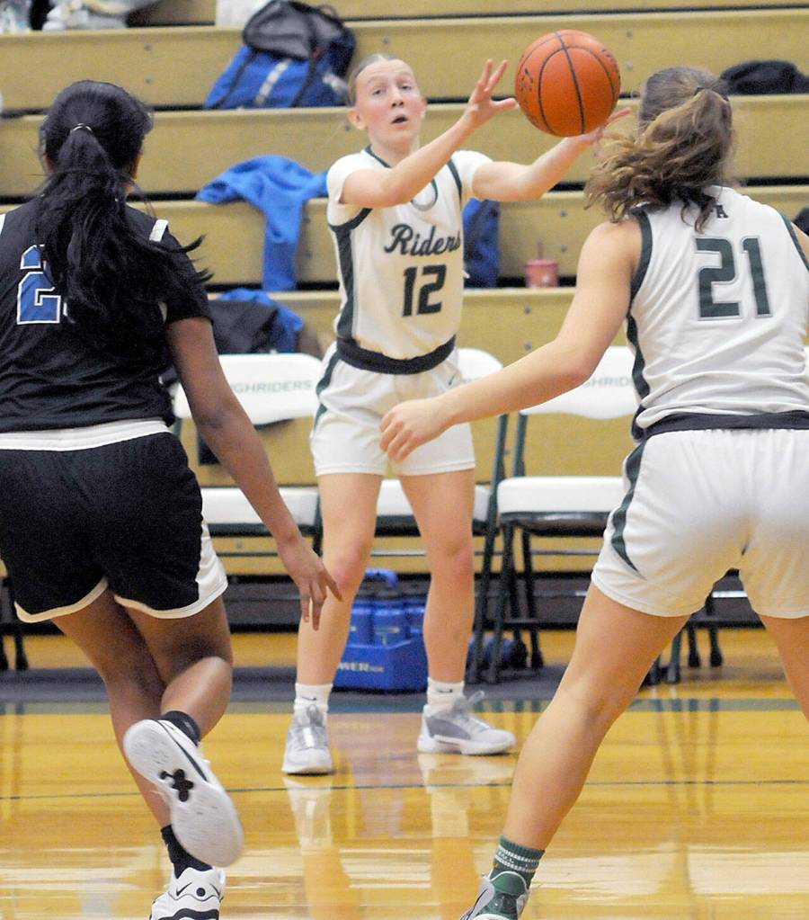 KEITH THORPE/PENINSULA DAILY NEWS Port Angeles Izzy Felton, center, pass along the sideline as North Masons Briana Cuauhtenango, left, and teammate Kennedy Rognlien keep watch on Thursday at Port Angeles High School.