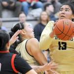 KEITH THORPE/PENINSULA DAILY NEWS 
Peninsula's Jelissa Julmist, right, looks for her chance at the goal as teammate Jenilee Donovan, center, fends off the Olympic defense, including Nohea Morrison, left, on Saturday at Peninsula College.