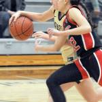 KEITH THORPE/PENINSULA DAILY NEWS 
Peninsula's Allie Green, back, outpaces Olympic's Missy May Valdez, front, on Saturday afternoon in Port Angeles.