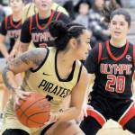 Peninsulas Sunny Pedebone, front, looks to pass defended by Olympics Marina Spitzer, right, and Suzanne Skinner, left, on Saturday in Port Angeles. (Keith Thorpe/Peninsula Daily News)