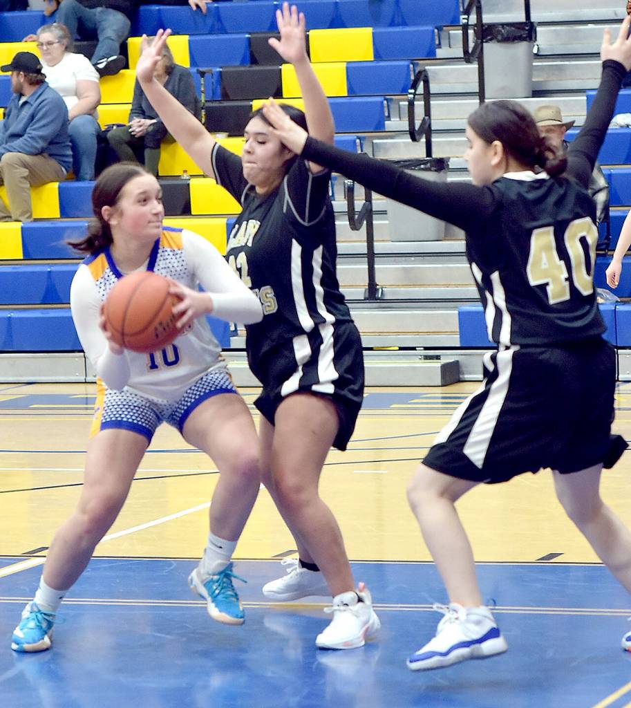 Crescents Alexis Dunavant, left, searches for an opening around Clallam Bays Jasmine Tinoco, center, and Aizhan Talantbek Kyzy on Tuesday in Joyce. (Keith Thorpe/Peninsula Daily News)