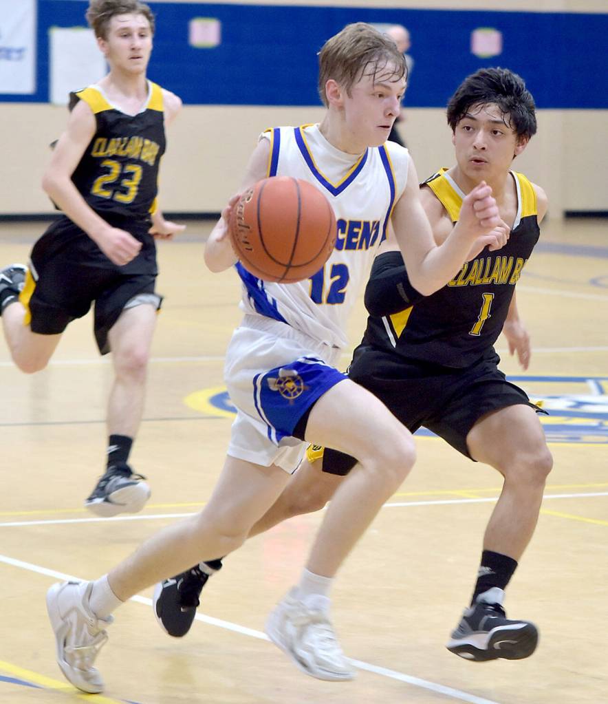 Crescents Mikah Love, center, charges downcourt paced by Clallam Bays Mauncio Cruz-Lopez as Clallam Bays Coletyn Hull follows behind on Tuesday night in Joyce. (Keith Thorpe/Peninsula Daily News)