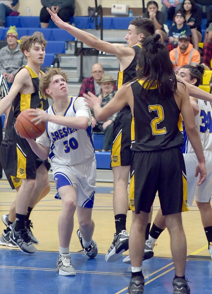 Crescents Henry Bourm, front left, aims for the rim circled by, from left, Clallam Bats Coletyn Hull, William Hull and Parker Prater on Tuesday at Crescent. (Keith Thorpe/Peninsula Daily News)