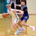 KEITH THORPE/PENINSULA DAILY NEWS Port Angeles Gus Halberg, left, avoids being tripped up by Bainbridges Kaden Thielman on Thursday in Port Angeles.