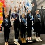 The Klahhane Xcel gold team of, from left, Carly Mae Riggs, Gracelyn Goss, Paytynn Lindley, Lainey DePiro and Raynee Ciarlo finished second at the Fire and Ice Challenge in Lacey this weekend. (Klahhane Gymnastics)