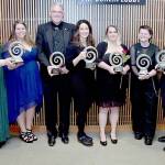 Winners of the 2024 Port Angeles Chamber of Commerce Community Awards gather after Saturday nights ceremony at Field Arts & Events Hall in Port Angeles. The winners are, from left, Becky McFarland and Stevie Boggard of Kindred Collective, emerging business of the year; Tom Baermann of Pacific Office Equipment, business of the year; Stacey Sanders, educator of the year; Sheryl Hamilton of Oxford House, organization of the year; Kennedy Cameron, young leader of the year; and Jeff Bohman, citizen of the year. (Keith Thorpe/Peninsula Daily News)
