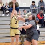 Peninsulas Allie Greene shoots from outside the lane defended by Shorelines Leiah Naeata on Wednesday in Port Angeles. (Keith Thorpe/Peninsula Daily News)
