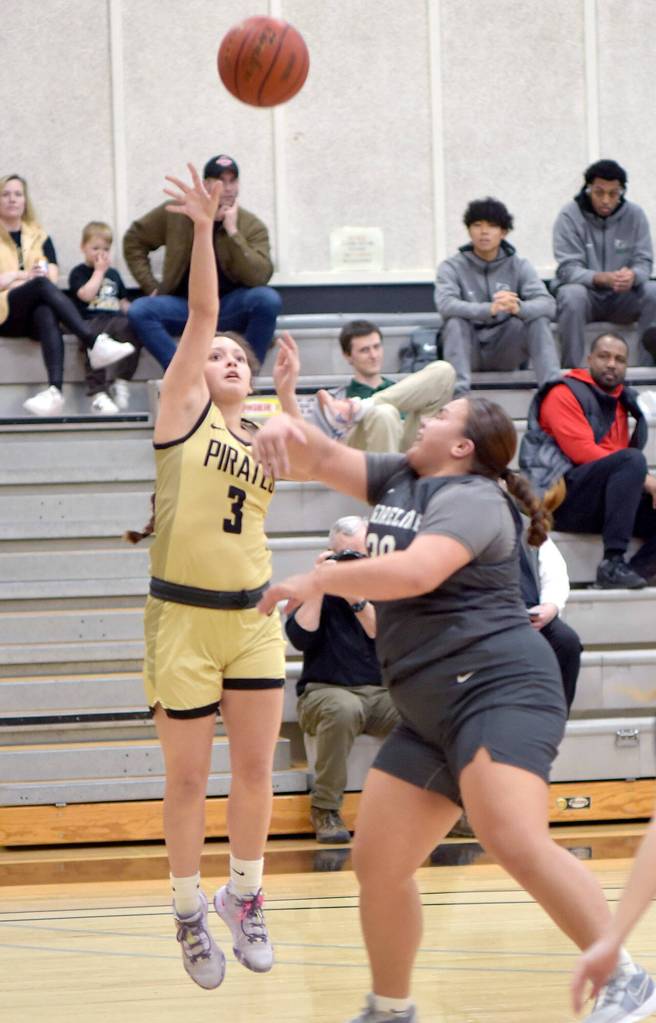 Peninsulas Allie Greene shoots from outside the lane defended by Shorelines Leiah Naeata on Wednesday in Port Angeles. (Keith Thorpe/Peninsula Daily News)