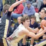 KEITH THORPE/PENINSULA DAILY NEWS 
Port Angeles' Parker Nickerson, center, pushes between Sequim's Ethan Melnick, left, and Lars Wiker on Tuesday night in Port Angeles.