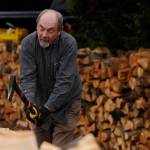 Ron Long lines up his axe as he and fellow woodcutters split wood at Jack Tatoms property last month. (Michael Dashiell/Olympic Peninsula News Group)