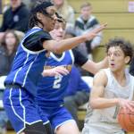 KEITH THORPE/PENINSULA DAILY NEWS 
Port Angeles' Kason Albaugh, right, tries to avoid being boxed in by Bremerton's Frank Allen, left, and Trenton Bulmer on Thursday in Port Angeles.