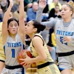 KEITH THORPE/PENINSULA DAILY NEWS 
Peninsula's Shania Moananu, from, presses to the key defended by Edmond's Maggie Salas, left, and Jada Walters on Saturday at Peninsula College.