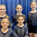 The Klahhane XCel Gold team of Carly Mae Riggs, Paytynn Lindley, Gracelyn Goss, Lainey DePiro and Raynee Ciarlo took first place at the Realm Classic gymnastics meet this weekend in Everett. (Courtesy photo)
