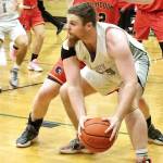 Port Angeles' Ezra Townsend looks to pass against Steilacoom in Port Angeles on Thursday. The Roughriders finished the game on a 33-7 run to come from behind and win 63-49 to move on to a state-qualifying game Saturday against Enumclaw. (Dave Logan/for Peninsula Daily News)