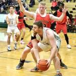 Port Angeles Ezra Townsend looks to pass against Steilacoom in Port Angeles on Thursday. The Roughriders finished the game on a 33-7 run to come from behind and win 63-49 to move on to a state-qualifying game Saturday against Enumclaw. (Dave Logan/for Peninsula Daily News)