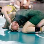 Forks' Peyton Johnson, left, battles Port Angeles' Faye Dachs at the Mat Classic at the Tacoma Dome this weekend. Johnson won with a pin and finished sixth in the state at 115 pounds. Dachs won two matches over the weekend. (Roger Harnack/Cheney Free Press)