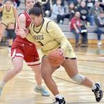 Peninsulas Jelissa Julmist, front, pushes her way to the lane past Skagit Valleys Jenae Rhoads on Wednesday evening at Peninsula College. (Keith Thorpe/Peninsula Daily News)