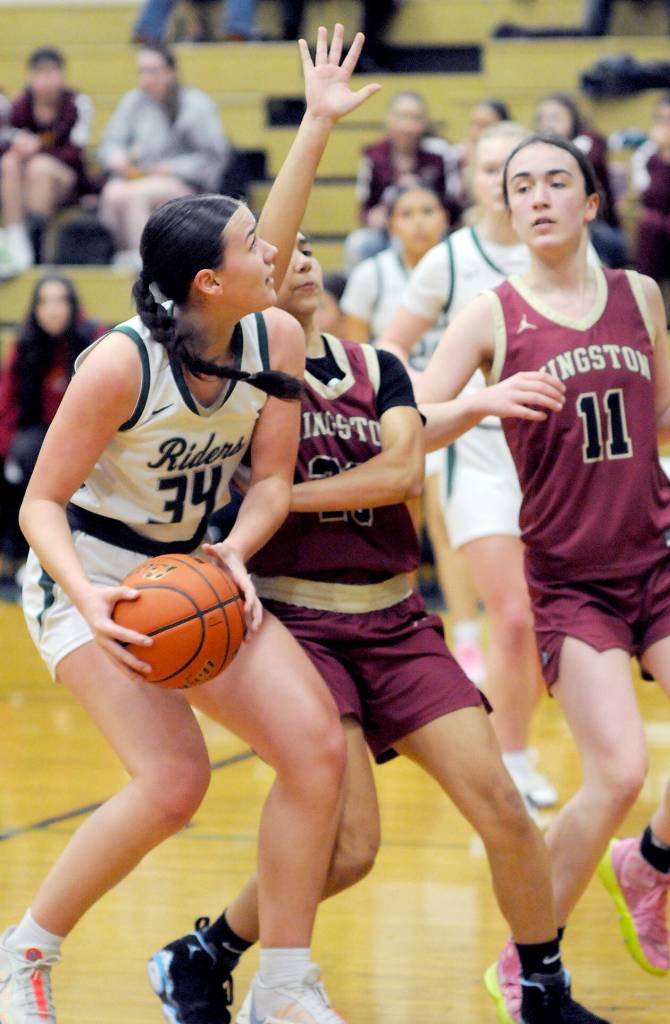 Port Angeles Lexie Smith, left, looks for the net defended by Kingstons Taizah Franklin, center, and Tavyn Belgarde, left, during a game earlier this season.