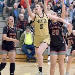 Peninsulas Alexa Mackey, center, goes for a layup surrounded by Everetts Ashlee Kluin, left, and Ghadir Ramadan on Saturday at Peninsula College. (Keith Thorpe/Peninsula Daily News)