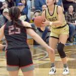 Peninsulas Jenilee Donovan sets up for a trey as Everetts Jada Andresen looks on during Saturdays home finale in Port Angeles. (Keith Thorpe/Peninsula Daily News)