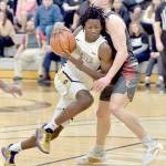 Peninsulas Ese Onakpoma, left, shoulders into Everetts Derek Smith on Saturday in Port Angeles. (Keith Thorpe/Peninsula Daily News)