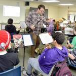 Music teacher Jesse Reynolds leads a sixth-grade band class through a song at Franklin School in Port Angeles. (KEITH THORPE/PENINSULA DAILY NEWS)