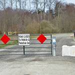 A gate and concrete barricades block the north end of Towne Road as it reaches the new Dungeness River levee on Tuesday northwest of Sequim. (Keith Thorpe/Peninsula Daily News)