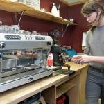Career and Technical Education student Maple Romberg, 16, prepares to make an espresso drink at the Wildcat Cafe on Friday in Port Angeles. (KEITH THORPE/PENINSULA DAILY NEWS)