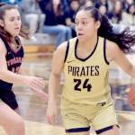 Peninsulas Shania Moananu, right, crosses the 3-point line as Everetts Ashlynd Hunt tries to keep up in a Feb. 28 game at Peninsula College. Moananu, a point guard, was named the North Region MVP and freshman of the year. (Keith Thorpe/Peninsula Daily News)