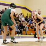 Chimacum seventh-grader Leighton Dunn stalks her opponent, Miles Hill of Port Angeles, at Blue Heron Middle School in Port Townsend last week. Dunn earned three takedowns only to fall in the second round in a pin. (Ryan White)