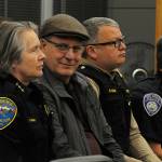 Sequim Police Chief Sheri Crain listens to a proclamation at the Feb. 26 Sequim city council meeting as her husband Pat smiles with pride in her during the ceremony. Next to Pat is Clallam County Sheriff Brian King and, to his right, Port Angeles Police Chief Brian Smith. (Matthew Nash/ Olympic Peninsula News Group)