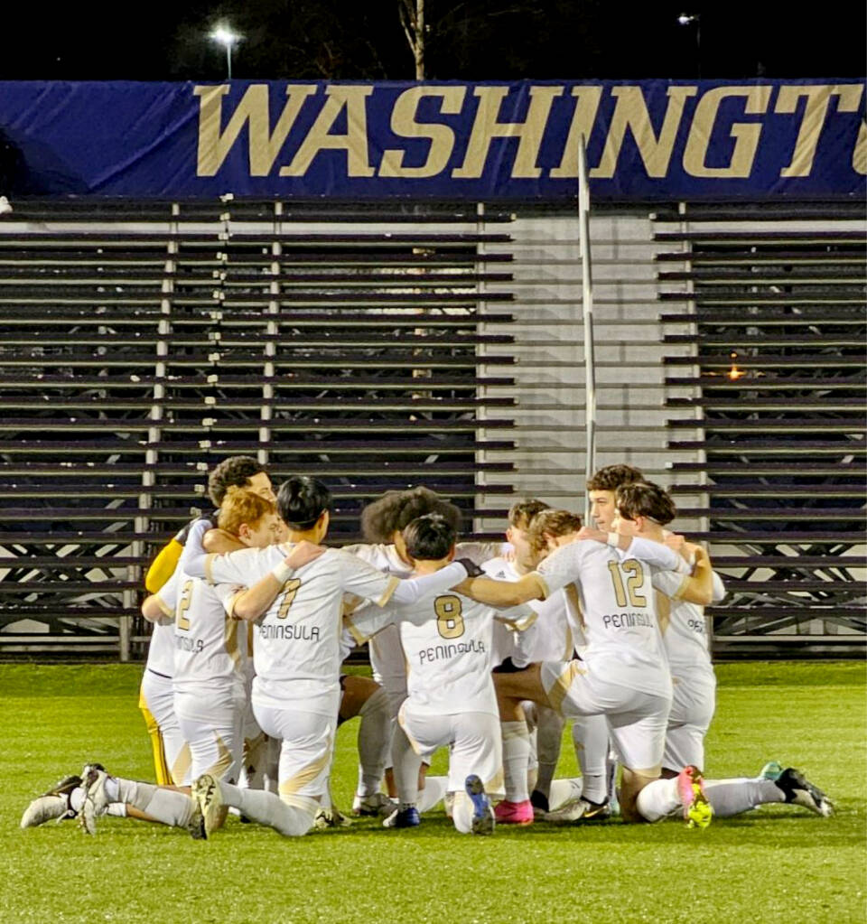 The defending NWAC champion Peninsula College mens soccer team meets before playing a scrimmage against the Washington Huskies on Sunday. (Peninsula College)