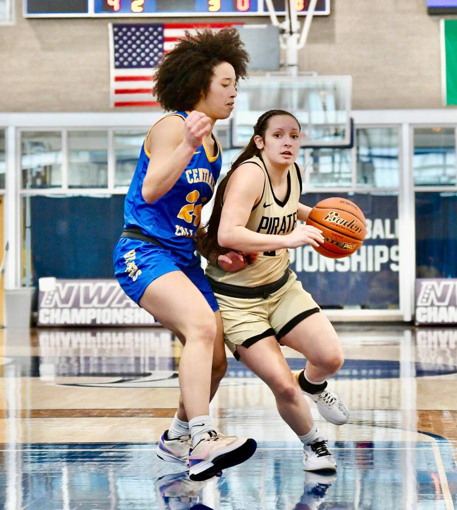 Jay Cline/Peninsula College Athletics Peninsulas Allie Greene dribbles around the defense of Centralias Madison Gore during the Pirates NWAC Womens Basketball Tournament victory Friday at Columbia Basin College in Pasco.