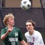 KEITH THORPE/PENINSULA DAILY NEWS
Port Angeles' Matthew Miller, left, takes control of the ball ahead of East Jefferson's Zephy Bell on Saturday at Peninsula College.