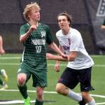 Port Angeles Matthew Miller, left, takes control of the ball ahead of East Jeffersons Zephyr Bell on Saturday at Peninsula College. (Keith Thorpe/Peninsula Daily News)