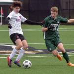 East Jeffersons Eduardo Martinez, left, fends off Port Angeles Caleb Lagrange on Saturday afternoon at Peninsula College. (Keith Thorpe/Peninsula Daily News)