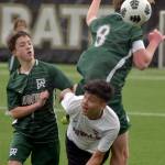 Port Angeles Jacob Weaver, top, takes the header over the top of East Jeffersons Aimando Sanchez, front, and teammate Kanyon Anderson on Saturday afternoon in Port Angeles. (Keith Thorpe/Peninsula Daily News)